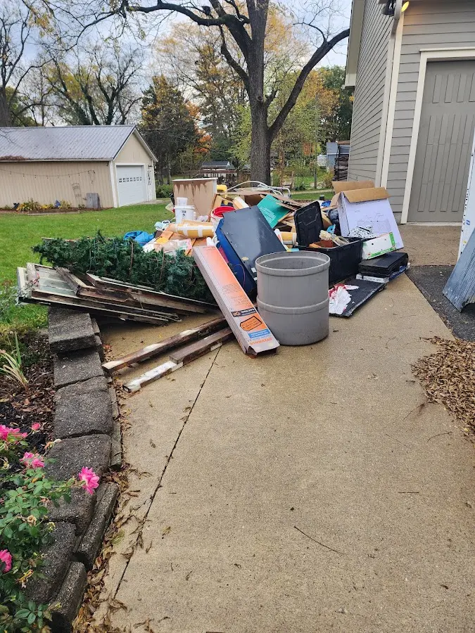 Dumpster being loaded with debris for 3 Yard Dumpster Rental in Macungie